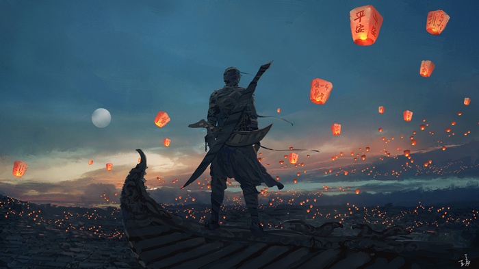 Man on rooftop releasing lanterns at dusk