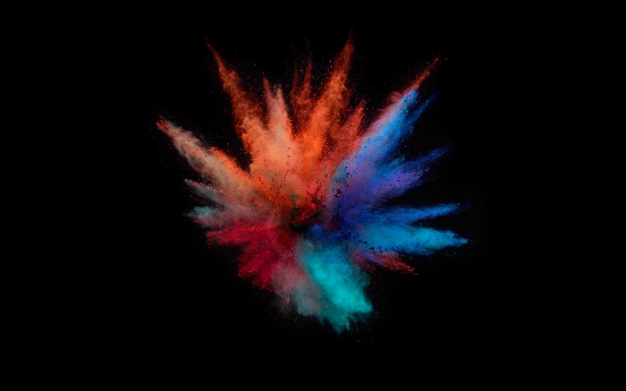 Colorful powder explosion on black background