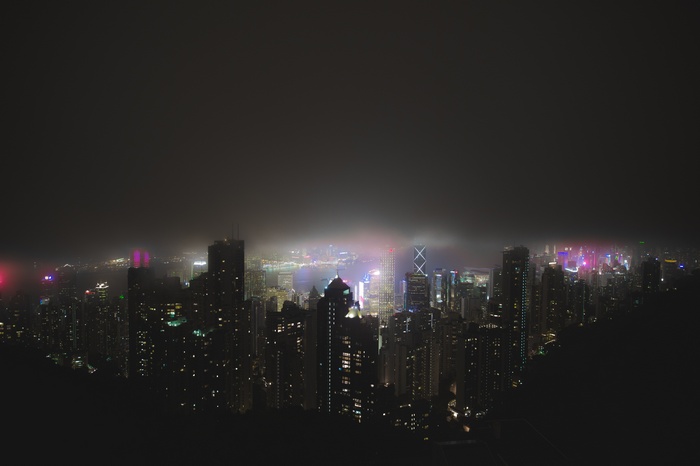 Hong Kong skyline at night with mist