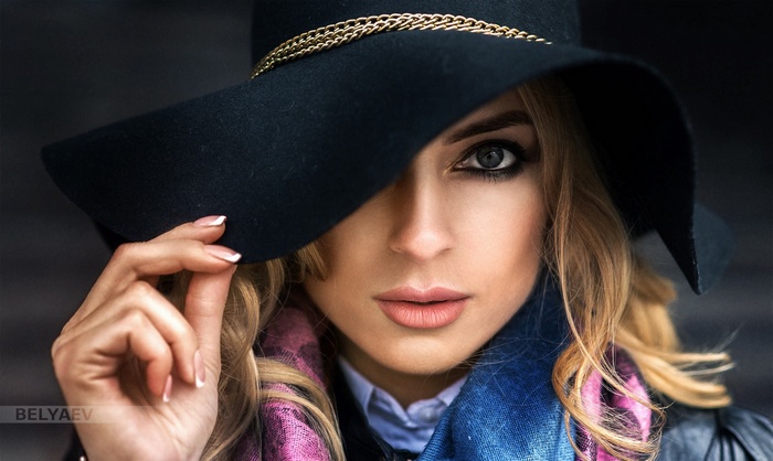 Woman in black hat and scarf, portrait by Dmitry Belyaev