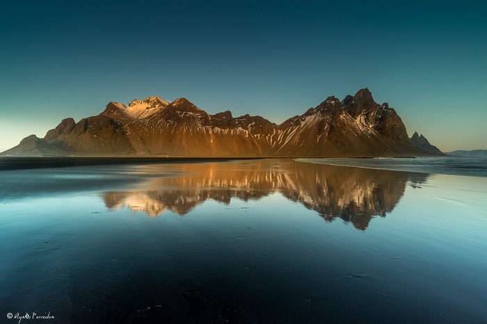 Vestrahorn Mountains reflected in water, Iceland