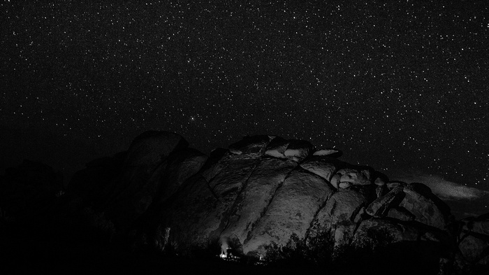 Rocky landscape under a starry night sky
