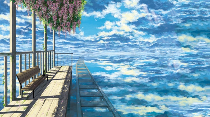 Bench on a wooden platform overlooking a cloudy sky and sea