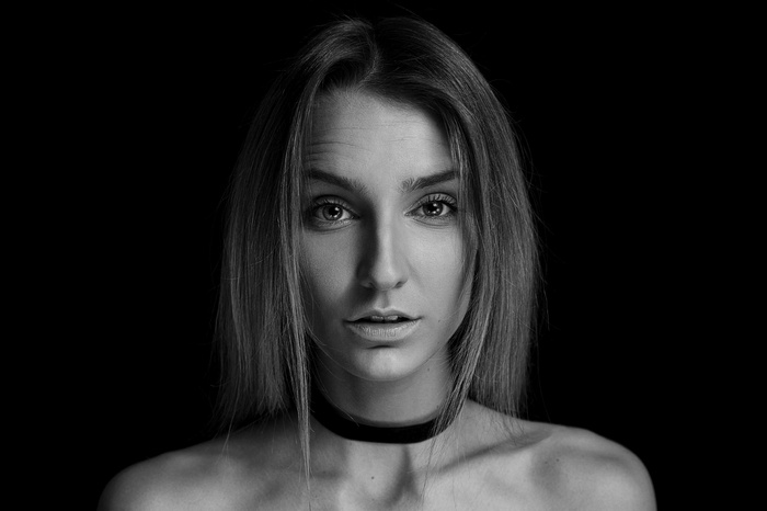 Monochrome portrait of a woman with a choker