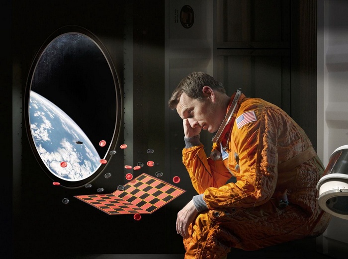 Astronaut playing checkers in a spaceship with Earth view