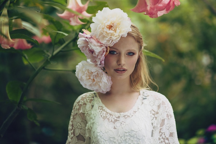Woman with flowers in her hair outdoors