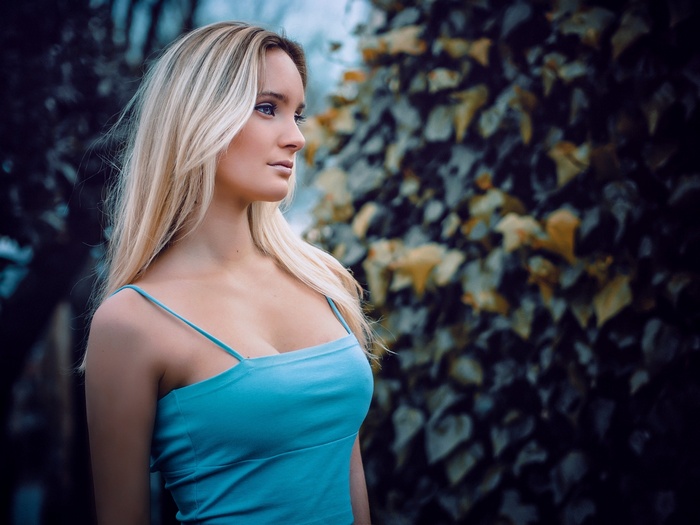 Woman with blonde hair in a blue top
