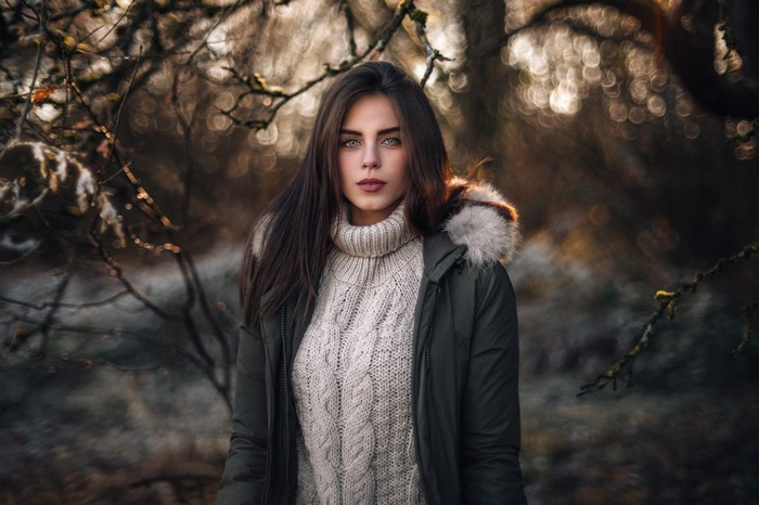 Woman wearing a turtleneck sweater and parka