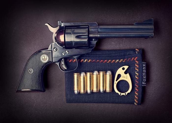 Ruger revolver with ammunition and bottle opener