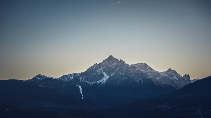 Snow-capped mountains under a clear sky