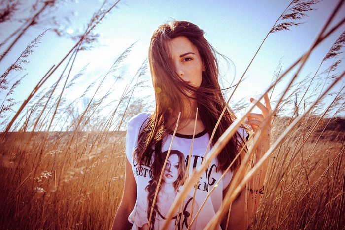 Woman in a field of tall grass