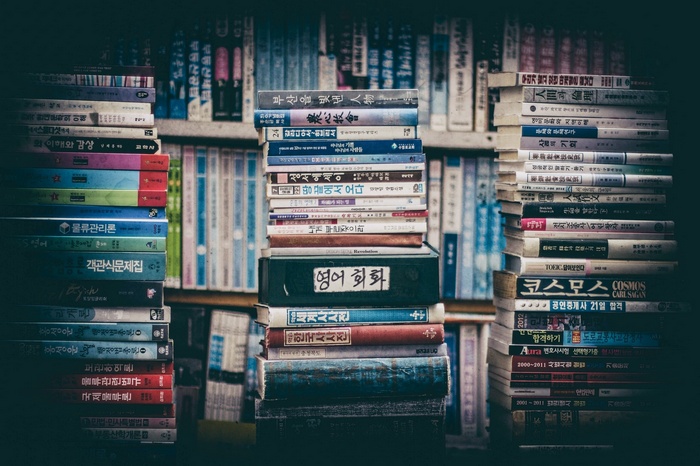 Stacks of Korean Books on Shelves