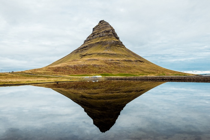 Kirkjufell mountain reflected in water