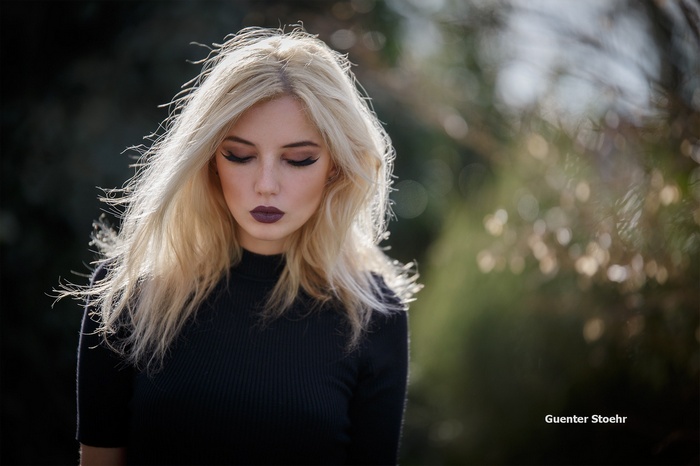 Portrait of a blonde woman with closed eyes