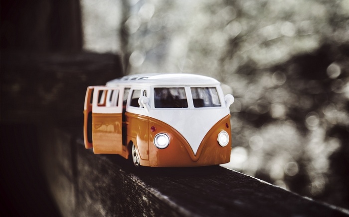 Orange and white Volkswagen Combi toy car