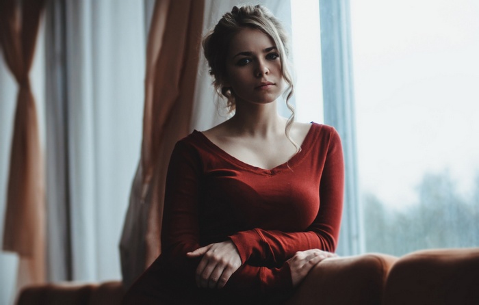Woman in red dress looking at viewer