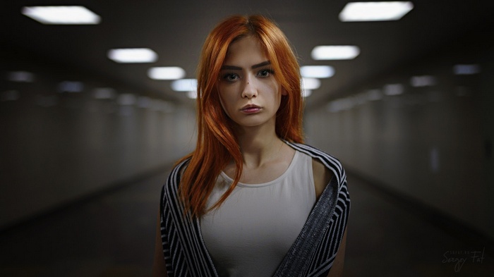 Redhead woman in a tunnel, portrait by Sergey Fat