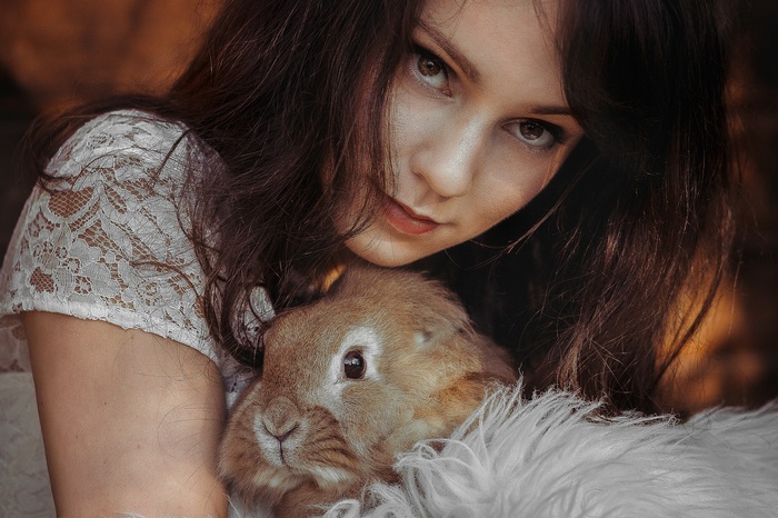 Woman holding a rabbit