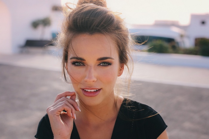 Woman with hair bun outdoors