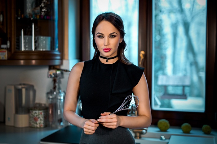 Aleska Diamond in a kitchen holding a whisk