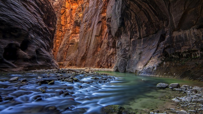 River flowing through a narrow canyon with tall rock walls