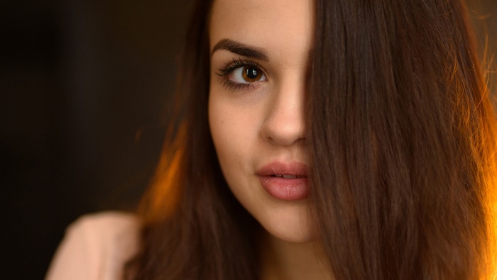 Woman with hair covering half her face