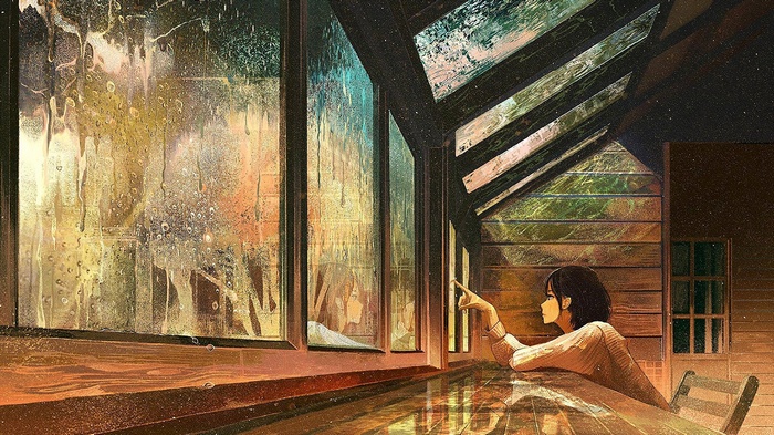 Girl looking out a rainy window