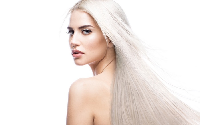 Woman with long blonde hair and bare shoulders