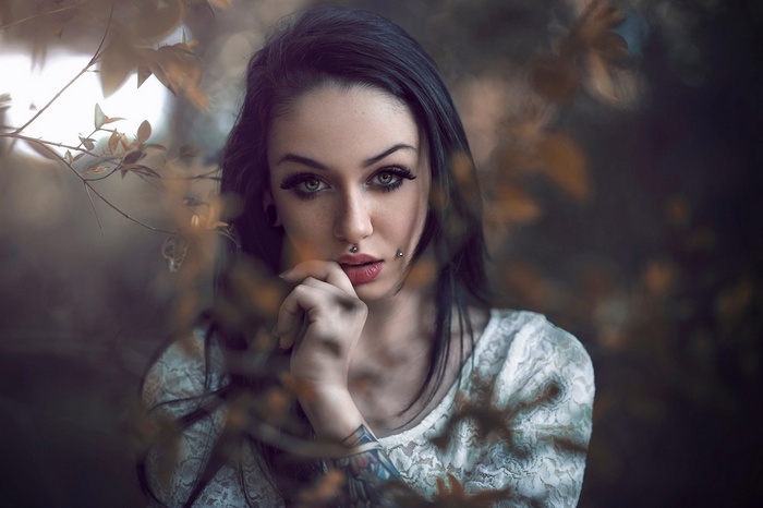 Portrait of a woman with piercings and tattoos