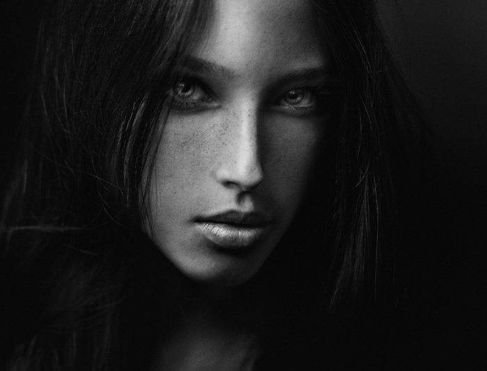 Monochrome portrait of a woman with freckles
