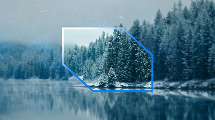 Winter forest landscape reflected in a lake