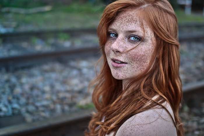 Woman with red hair and freckles