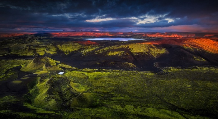 Aerial view of Icelandic landscape with lake at sunrise