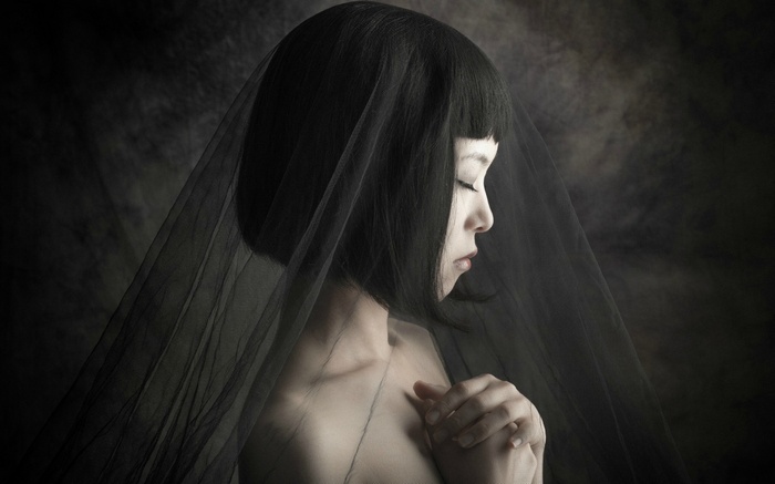 Asian woman with black bob haircut and veil