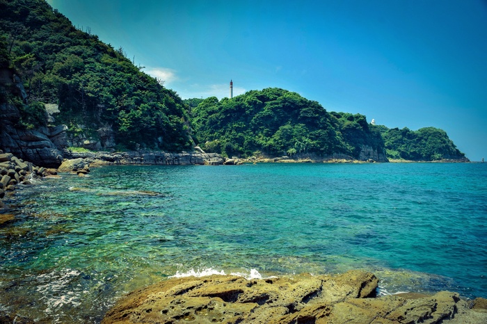 Coastal landscape with green hills and turquoise water