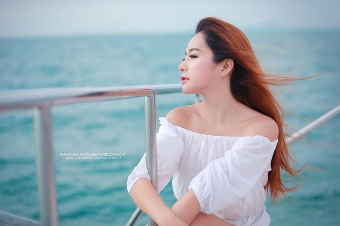 Model on a boat in Thailand