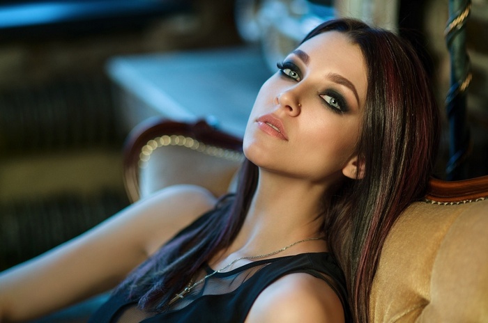 Woman with dark hair and smoky eye makeup