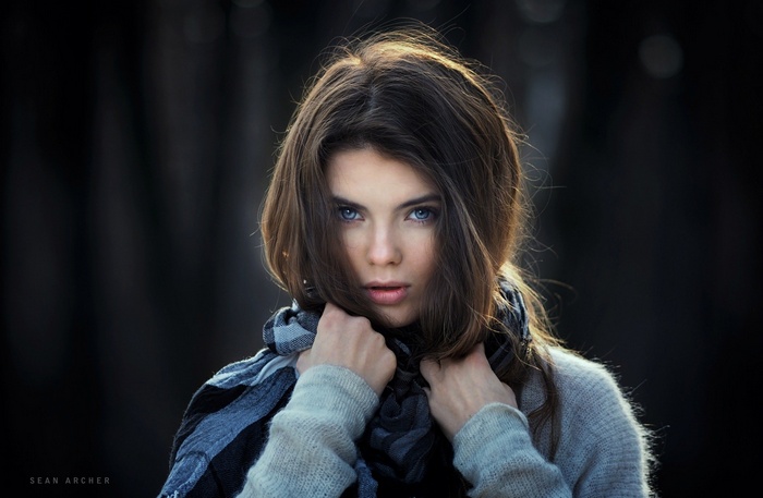 Portrait of a woman with blue eyes wearing a scarf