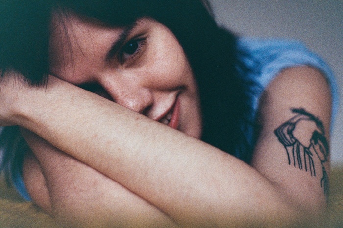 Woman with tattoo smiling