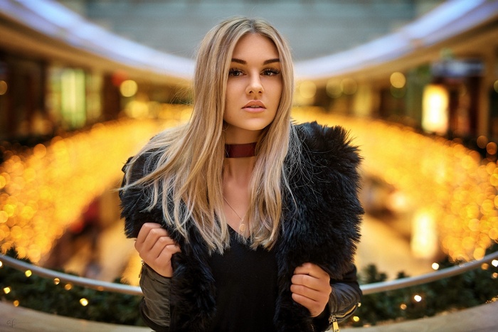 Woman wearing a black fur coat and choker