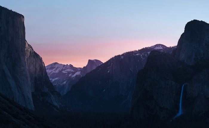 Yosemite National Park mountains at sunset with waterfall