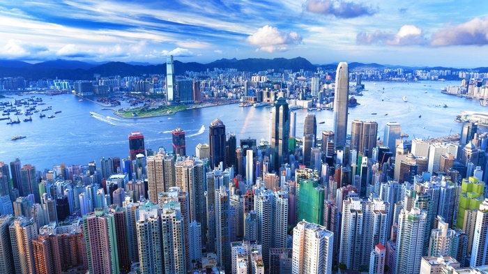 Hong Kong cityscape with Victoria Harbour and mountains