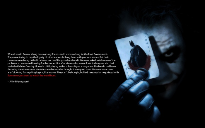 Joker holding a Joker card from The Dark Knight