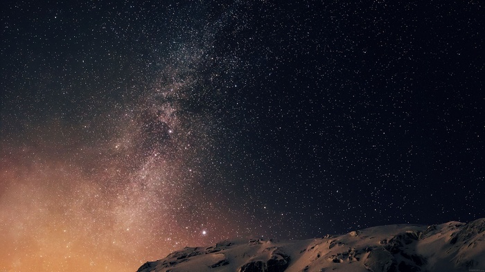 Milky Way over snow-covered mountains