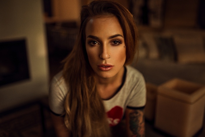 Woman with tattoos and nose ring