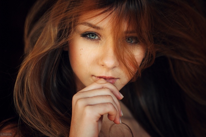 Portrait of a young woman with red hair