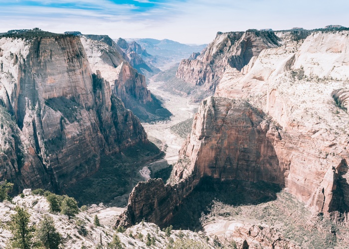 Majestic canyon landscape with winding river and blue sky
