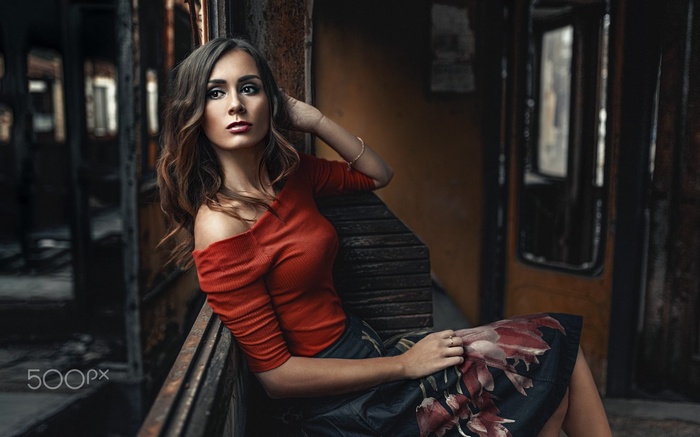 Katarzyna Kluska sitting in a train car