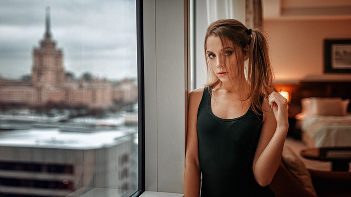 Ksenia Kokoreva with pigtails in a tank top