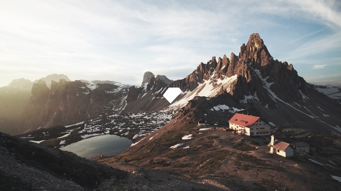 Mountain range with a lake and buildings